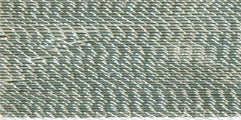Close-up of white metallic embroidery thread on a spool