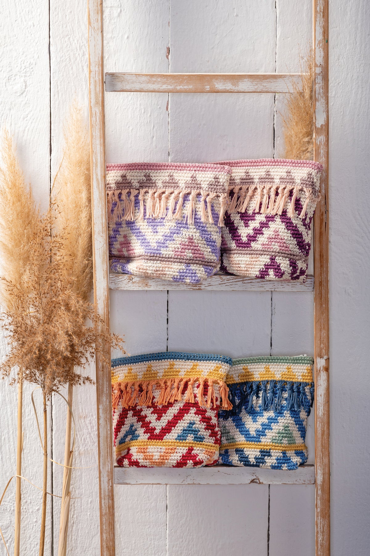 Crocheted boho zip pouch in brights colours from the Anchor kit