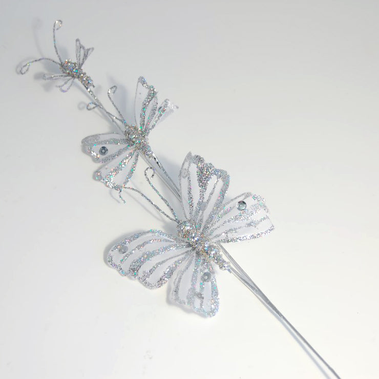 Three white and silver glitter sequin butterflies on picks