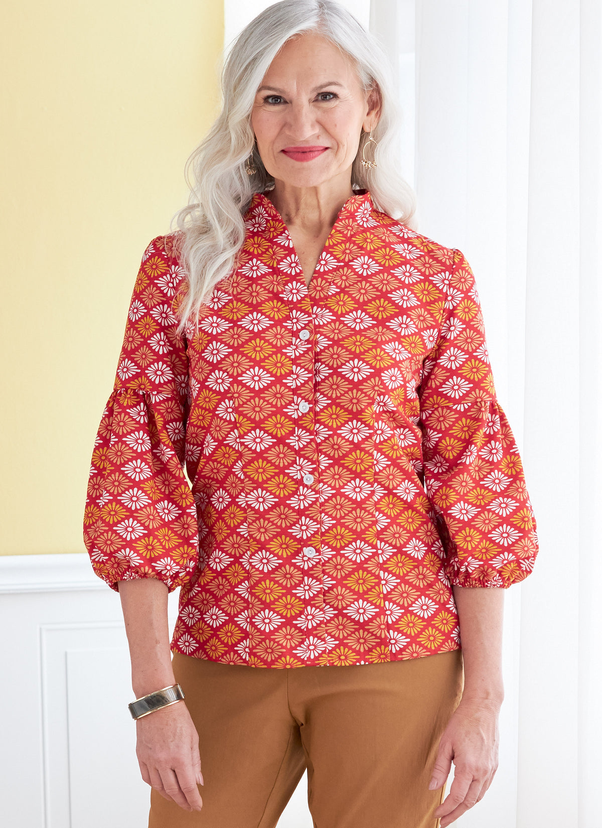 Butterick B6816 sewing pattern envelope showing women's button front top designs
