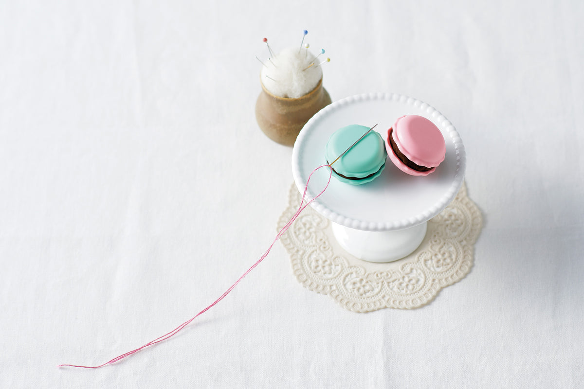Raspberry coloured Clover macaron needle sharpener