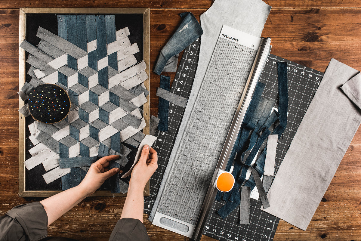 Fiskars rotary cutter attached to a long acrylic ruler