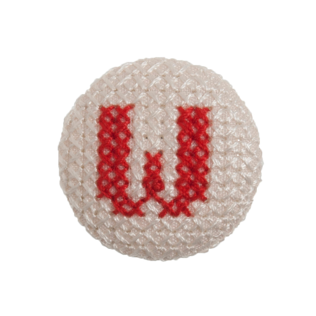 Round button with a red cross-stitch letter W