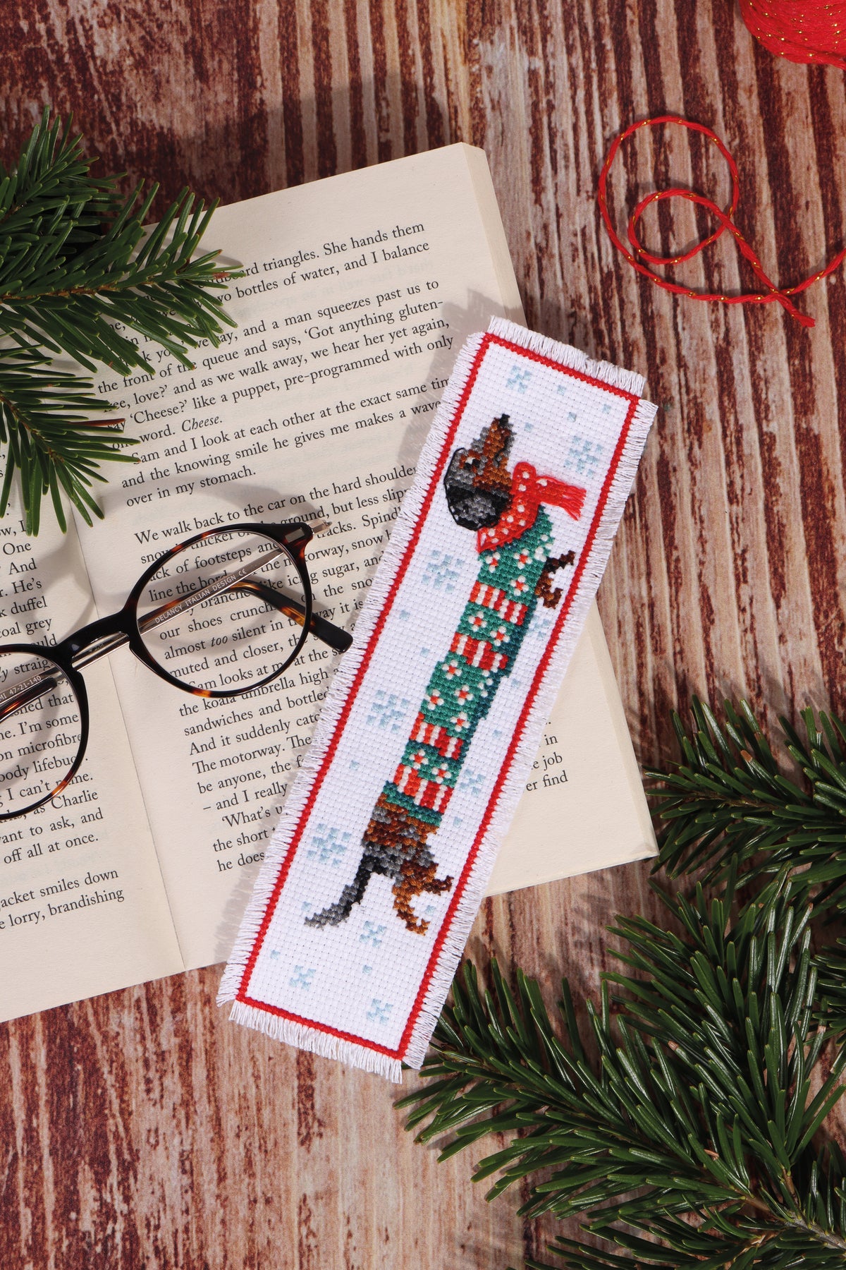 Trimits cross stitch bookmark kit showing a Silly Sausage design