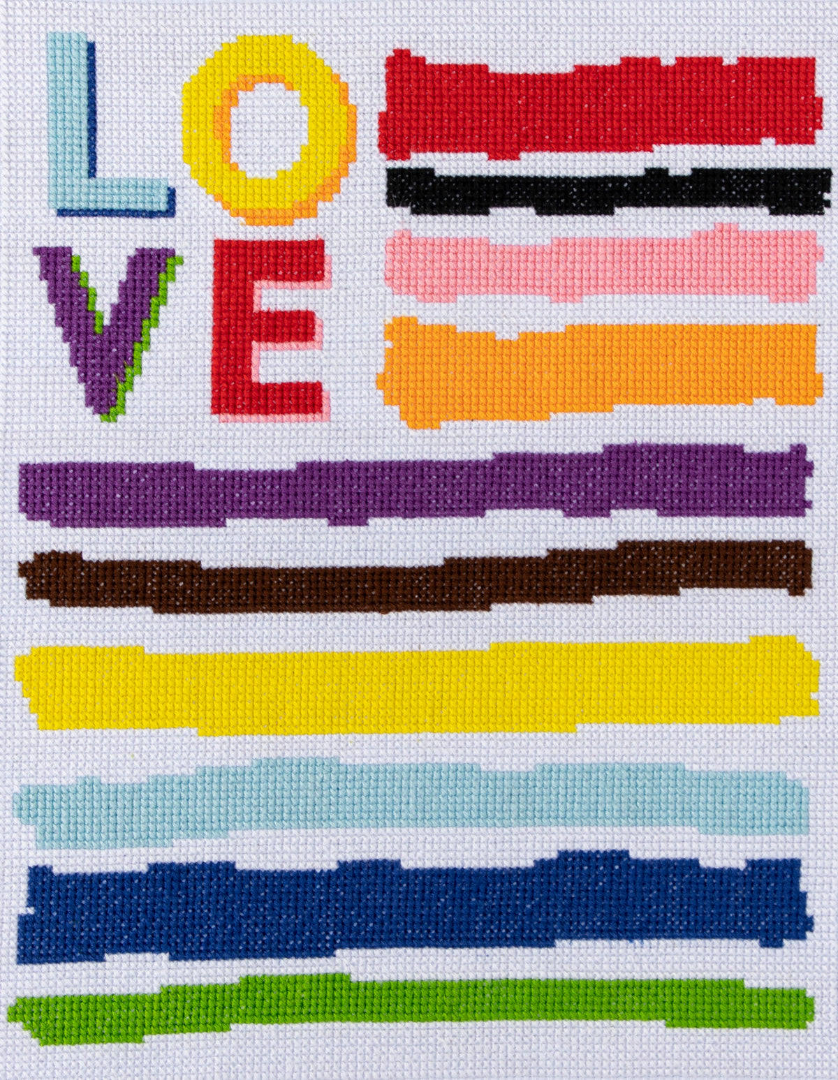Trimits Love cross stitch kit packaging showing the finished design