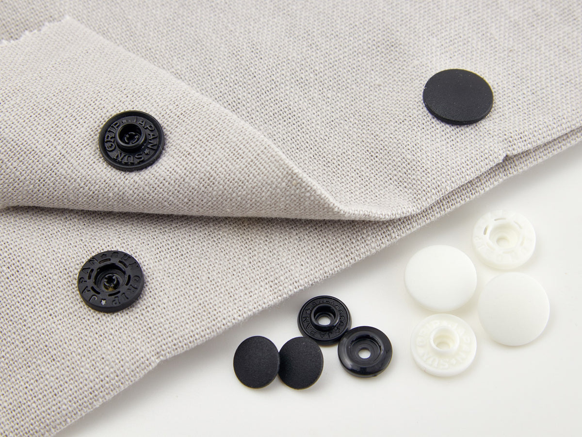 Pack of black 9mm plastic snap fasteners