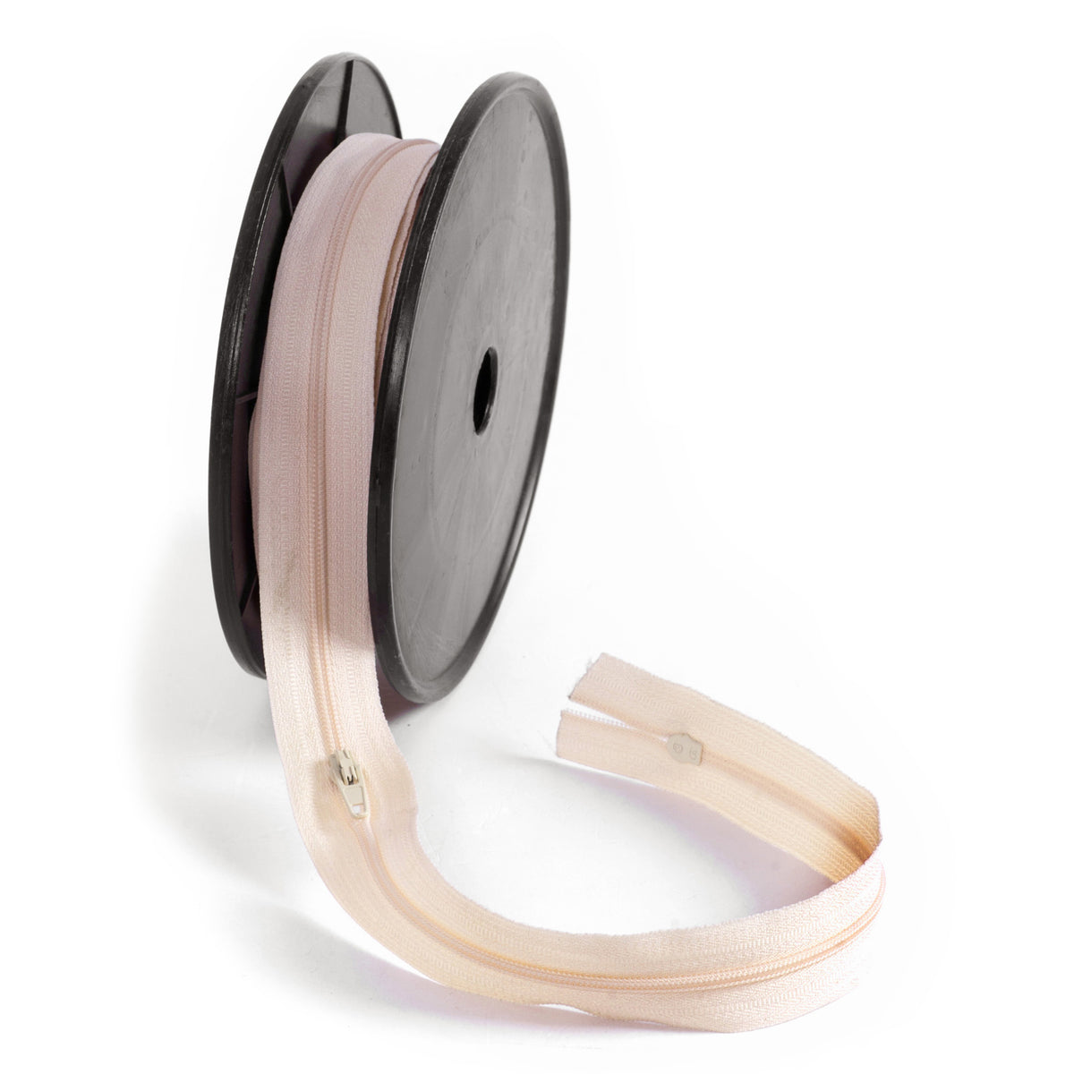 Roll of dark cream continuous nylon zip with sliders