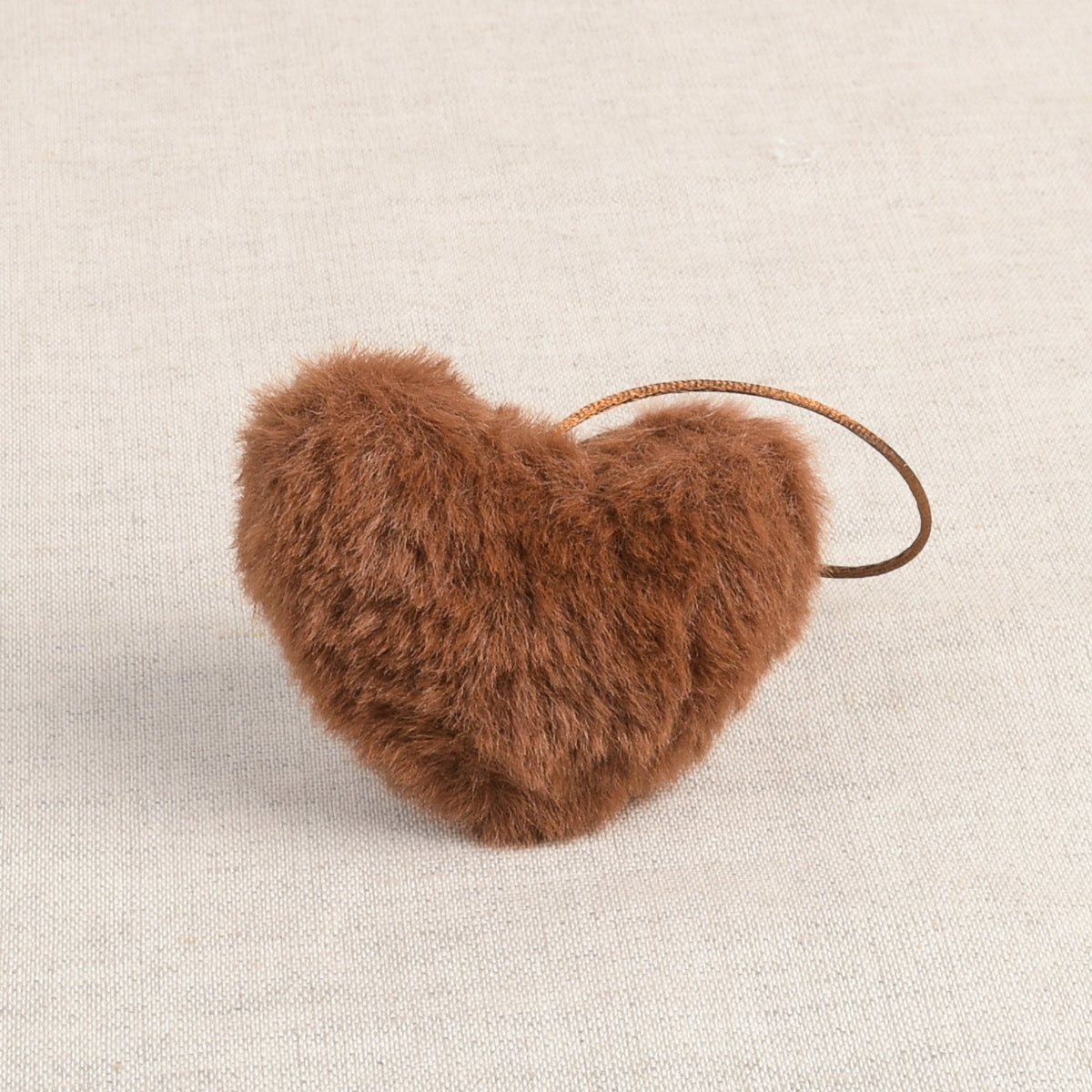 Caramel faux fur heart-shaped pom pom with loop