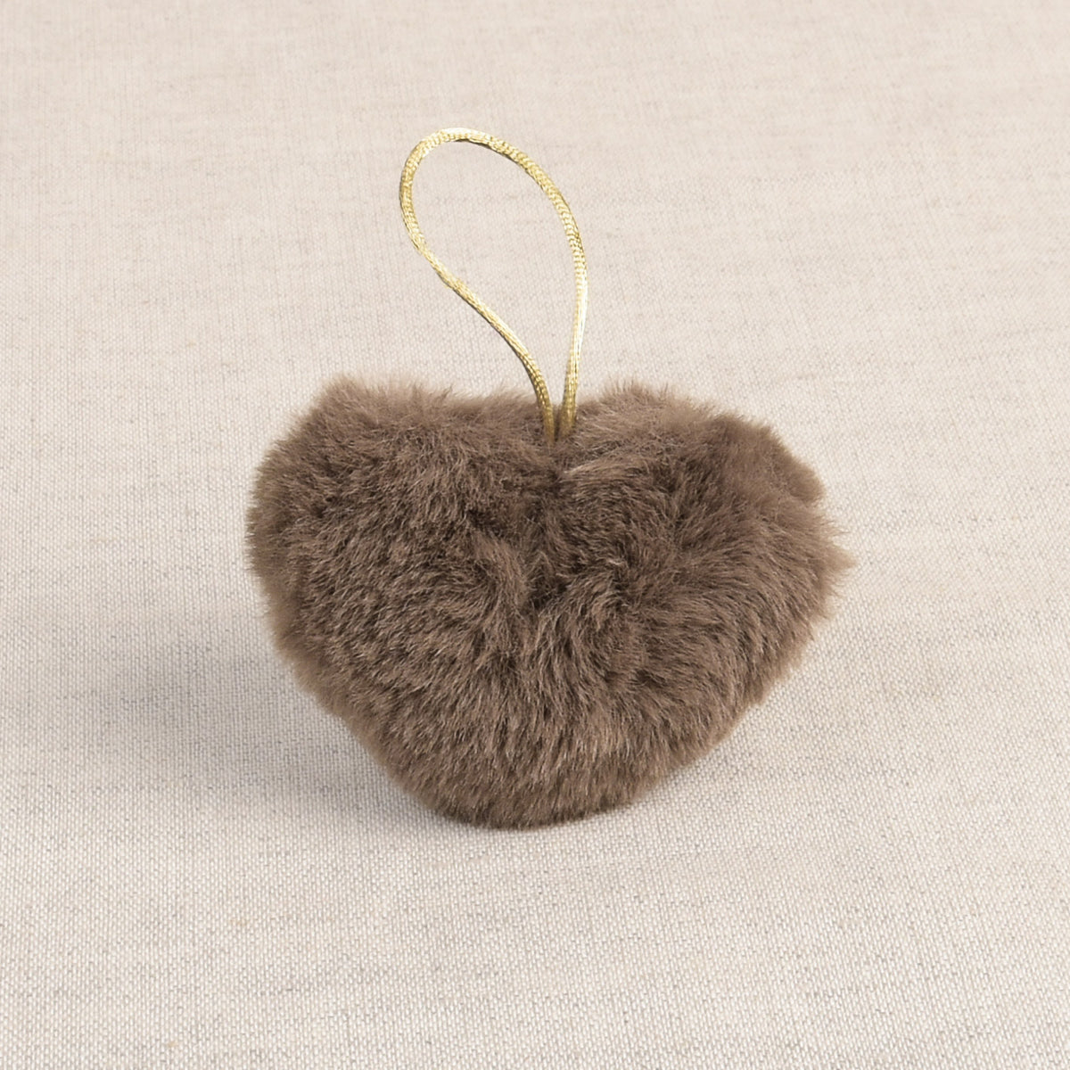 Taupe faux fur heart-shaped pom pom with a hanging loop