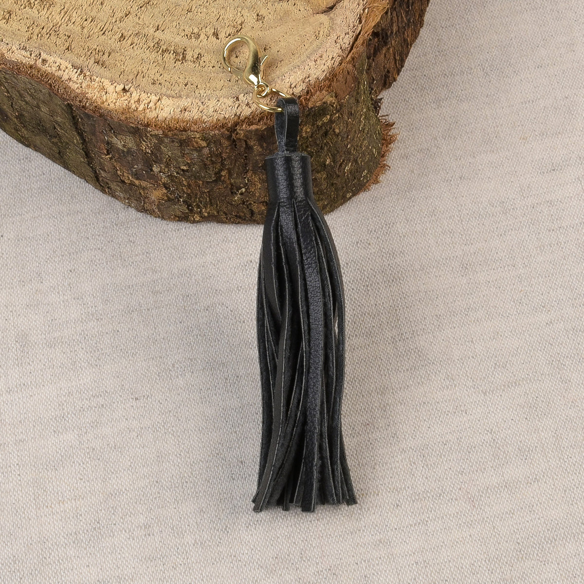 Black tassel with a fastener at the top