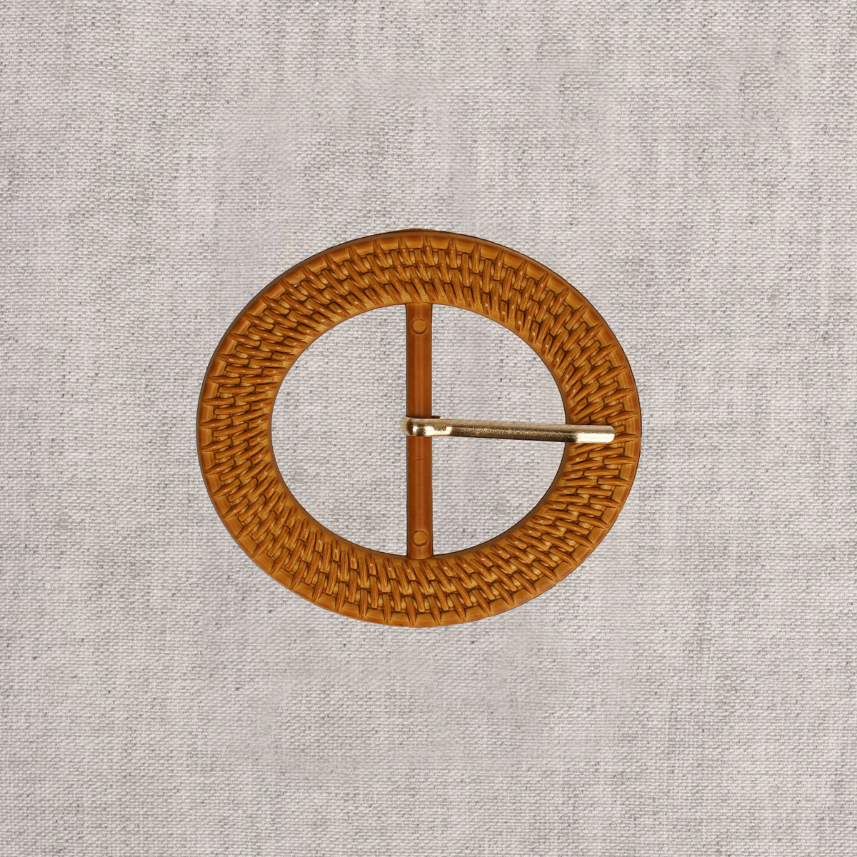 Oval tan woven rattan-look belt buckle with a gold-tone prong