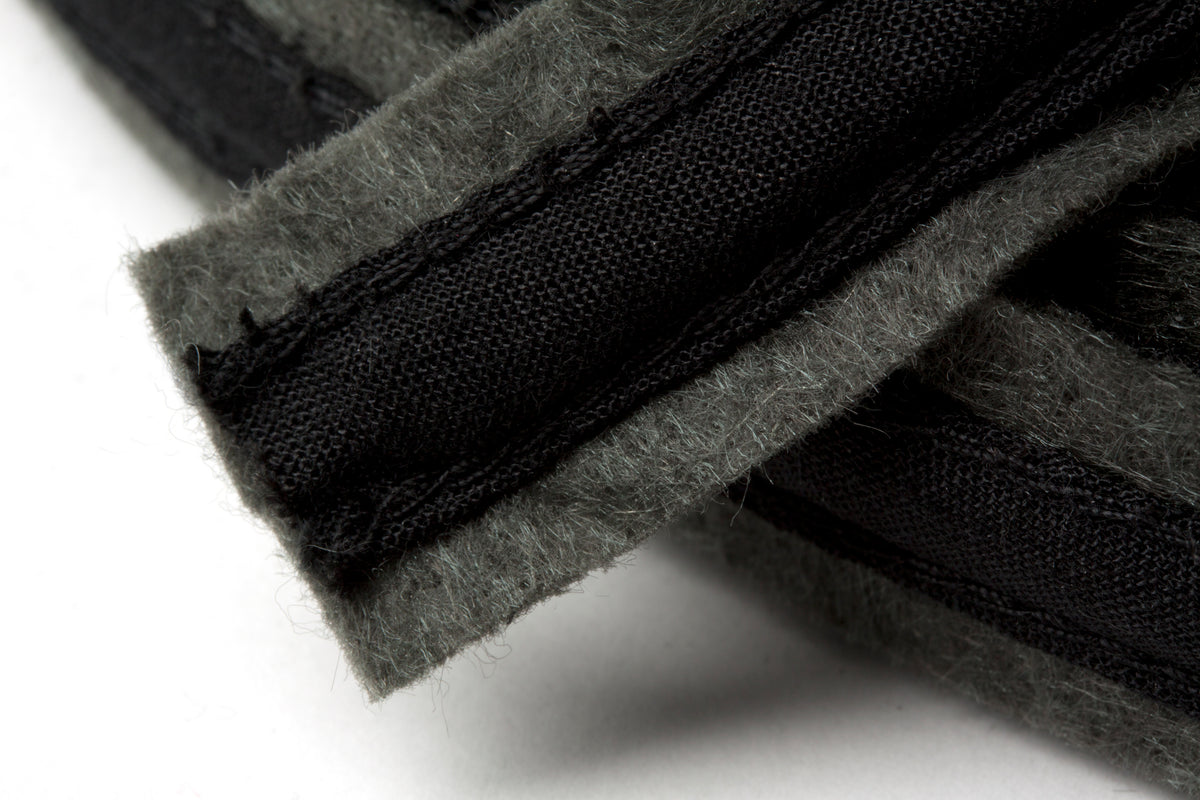 Dark grey felt covered polyester boning