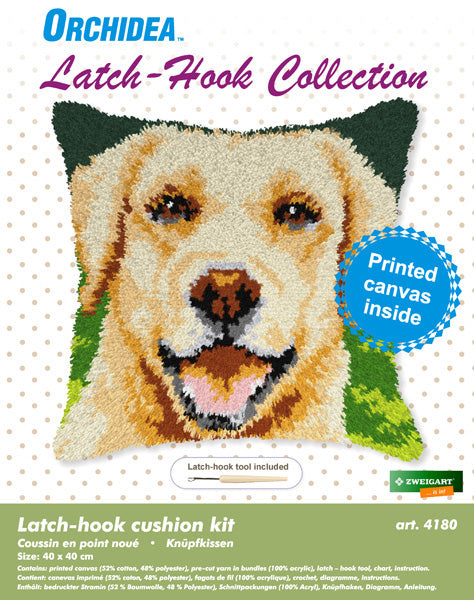 Finished Orchidea latch hook cushion showing a smiling golden-coated dog on a green background