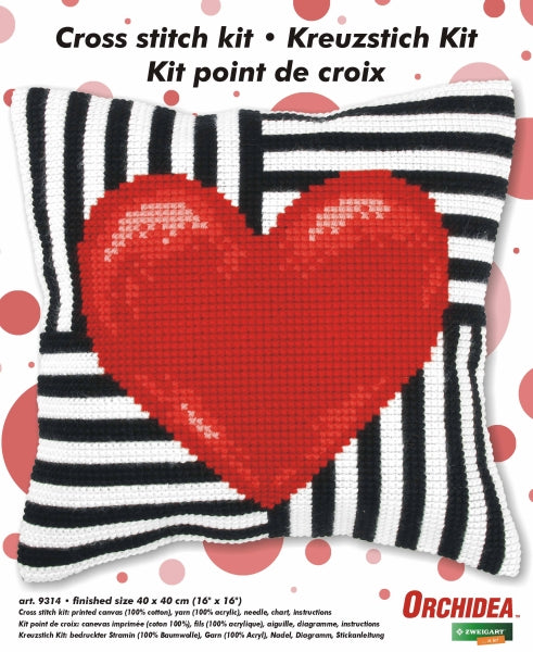 Finished cross stitch cushion with a red heart design