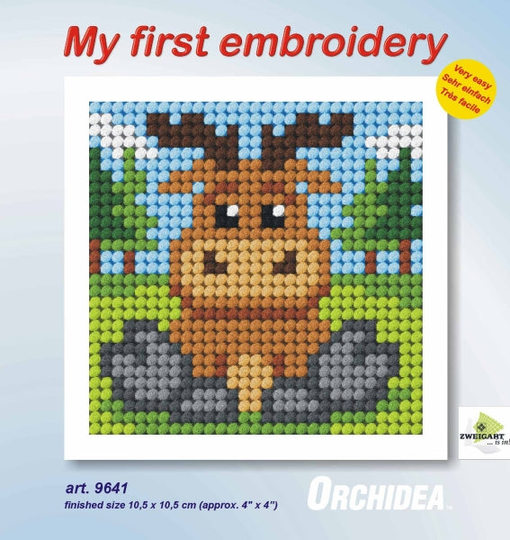 Finished beginner's needlepoint picture showing a reindeer