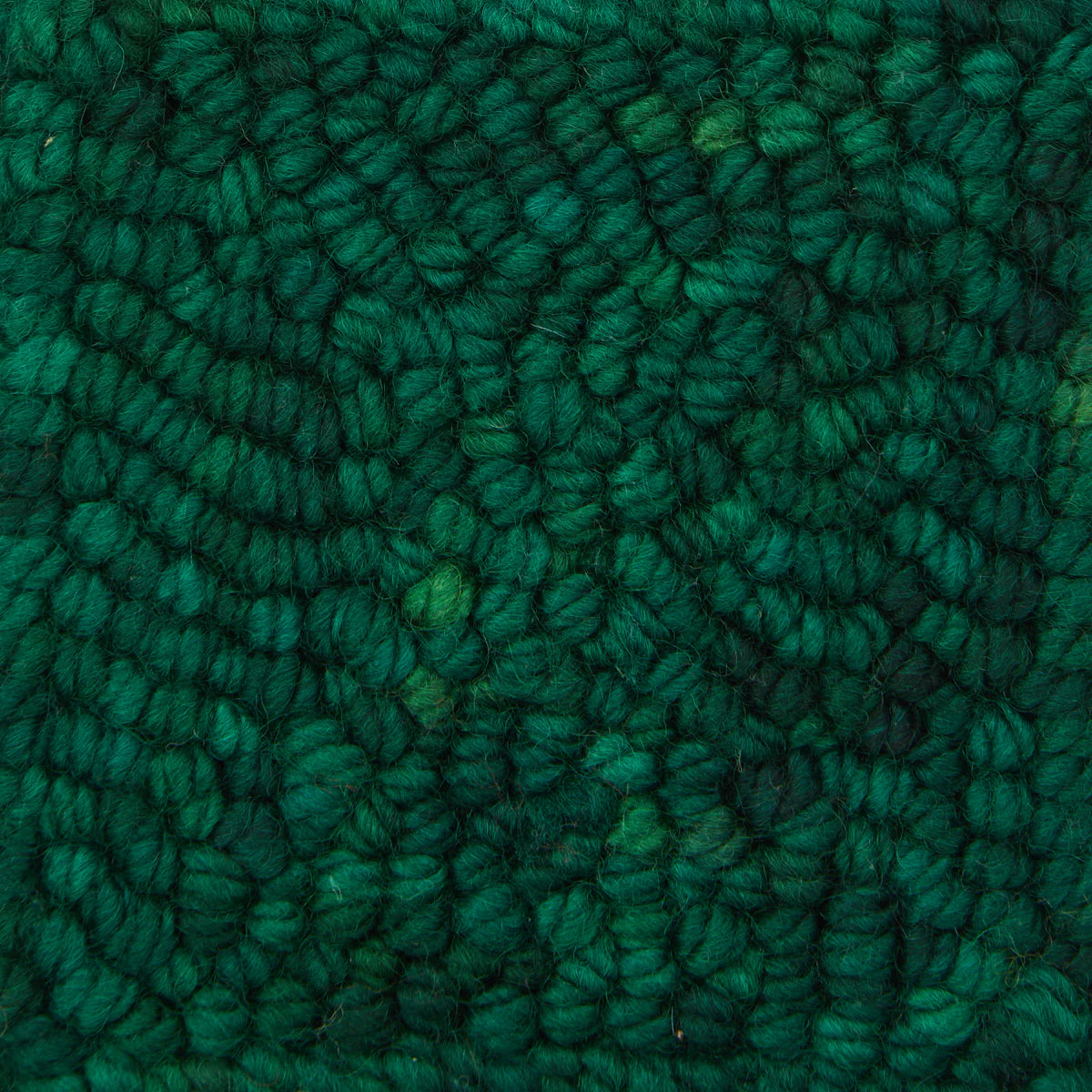 Skein of variegated Evergreen Dark rug weight punch needle wool yarn