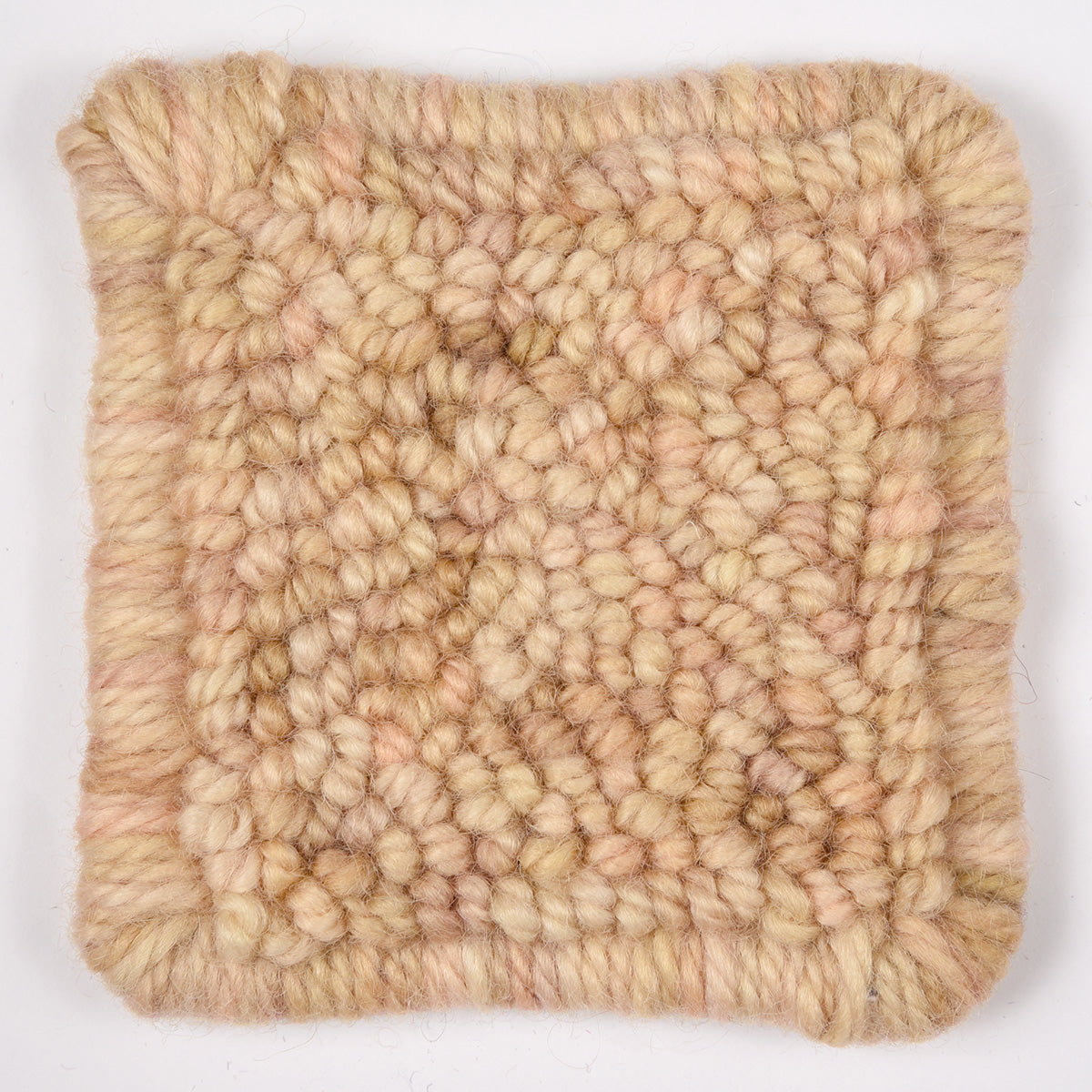 Skein of variegated Desert Sands rug weight punch needle wool yarn