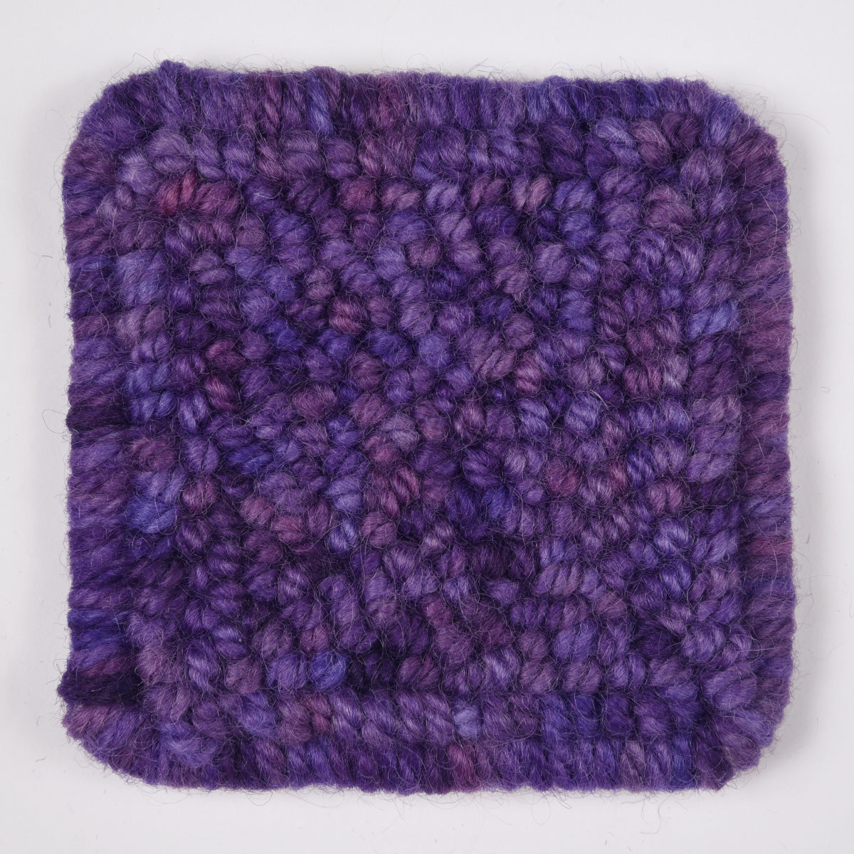 Skein of variegated Purple Reign punch needle rug yarn