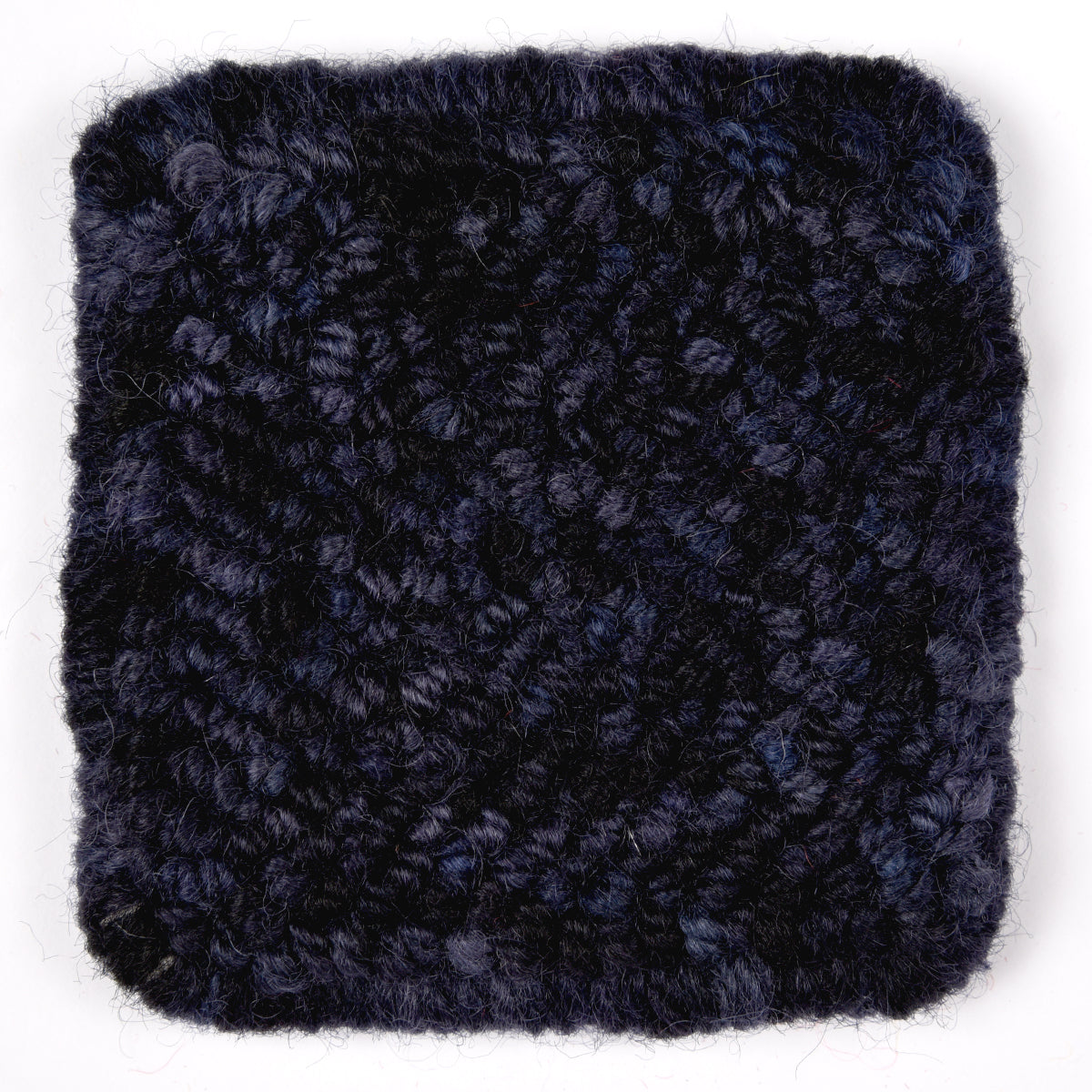 Skein of variegated Blackbird rug weight punch needle wool yarn