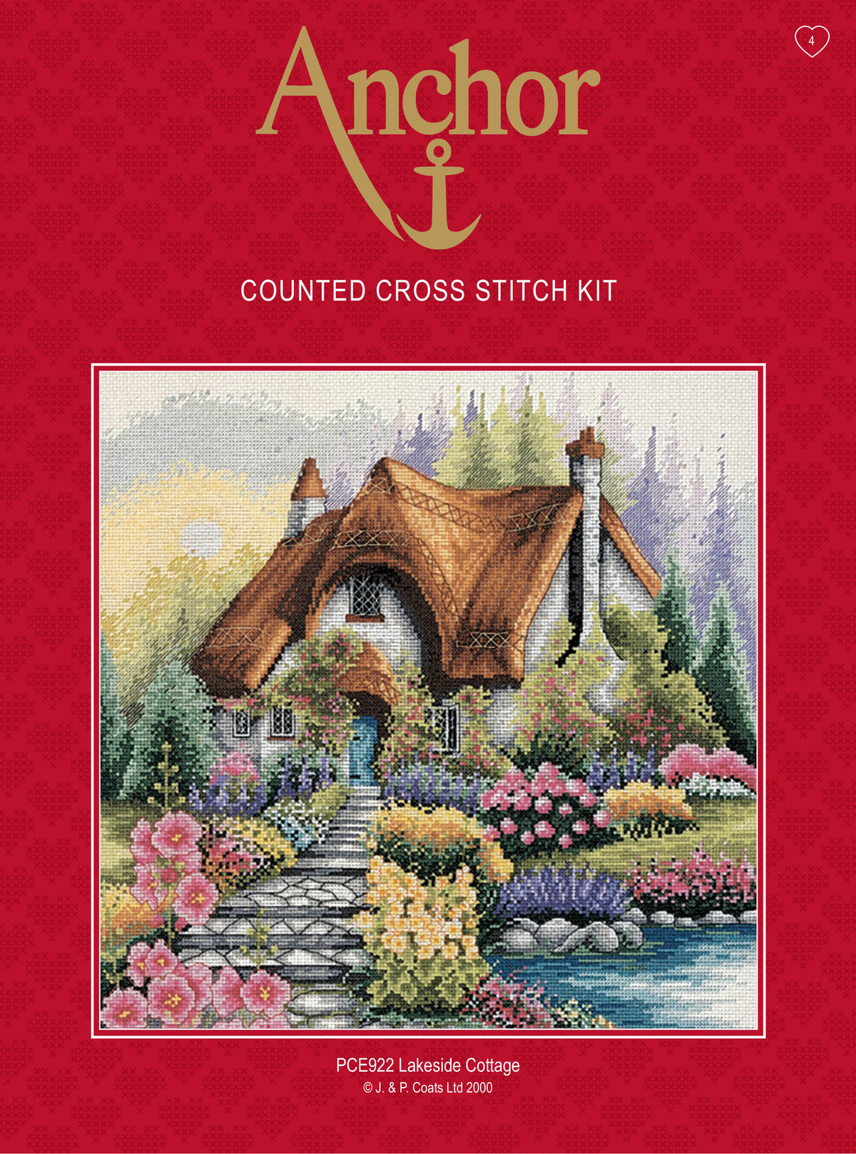 Anchor Lakeside Cottage cross stitch kit showing a cottage by a lake