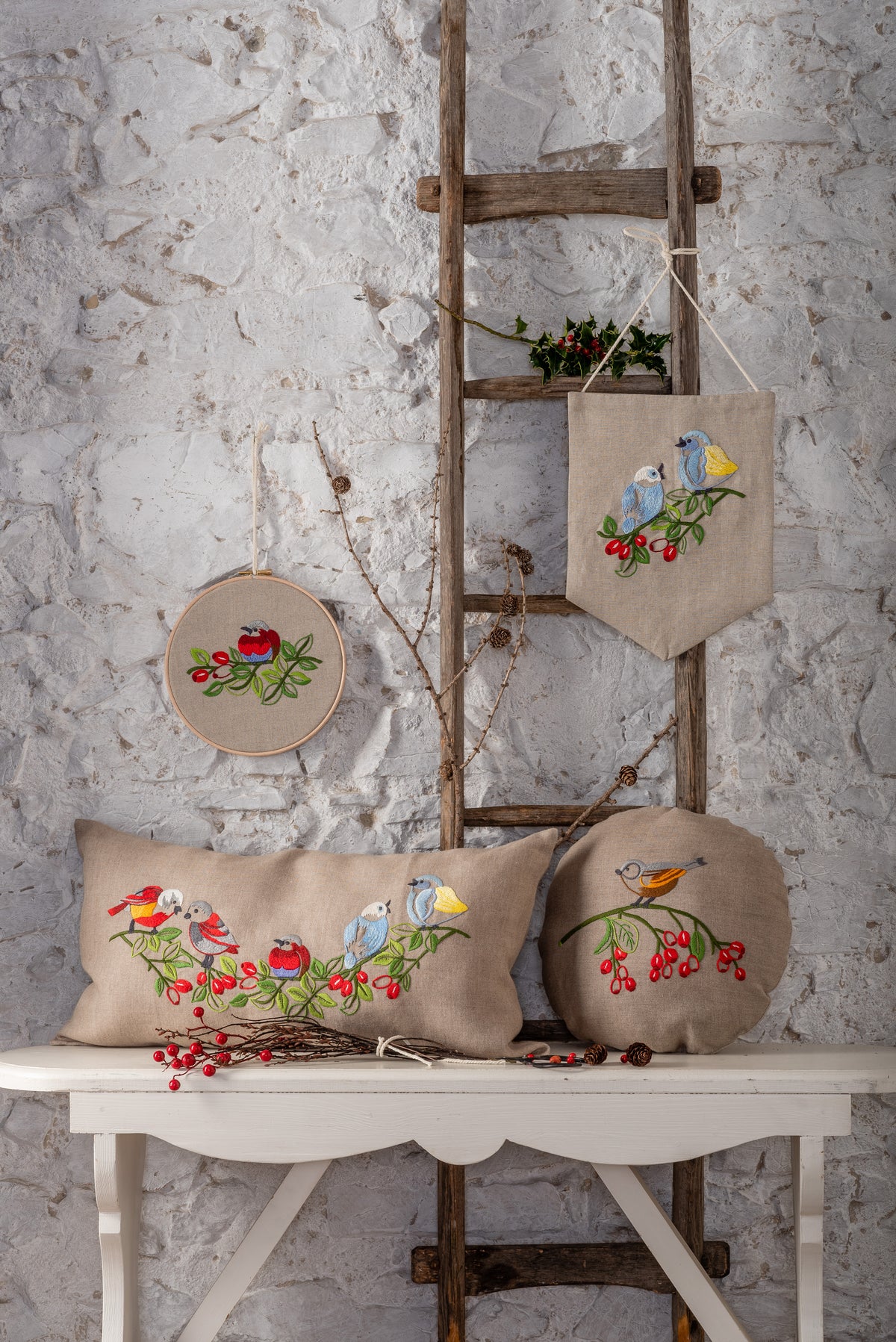 Round embroidered cushion with vintage bird design