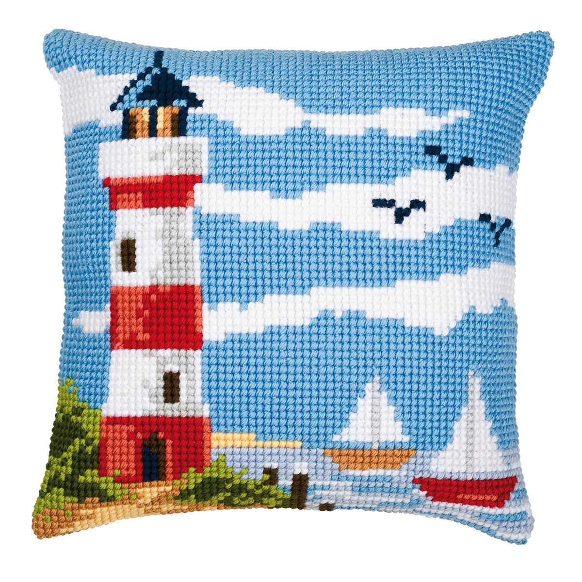 Finished cross stitch cushion showing a lighthouse scene
