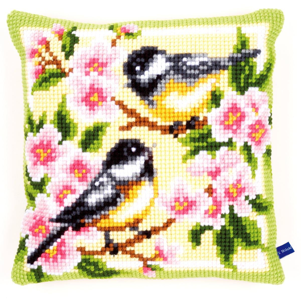 Cross stitched cushion with birds and blossom