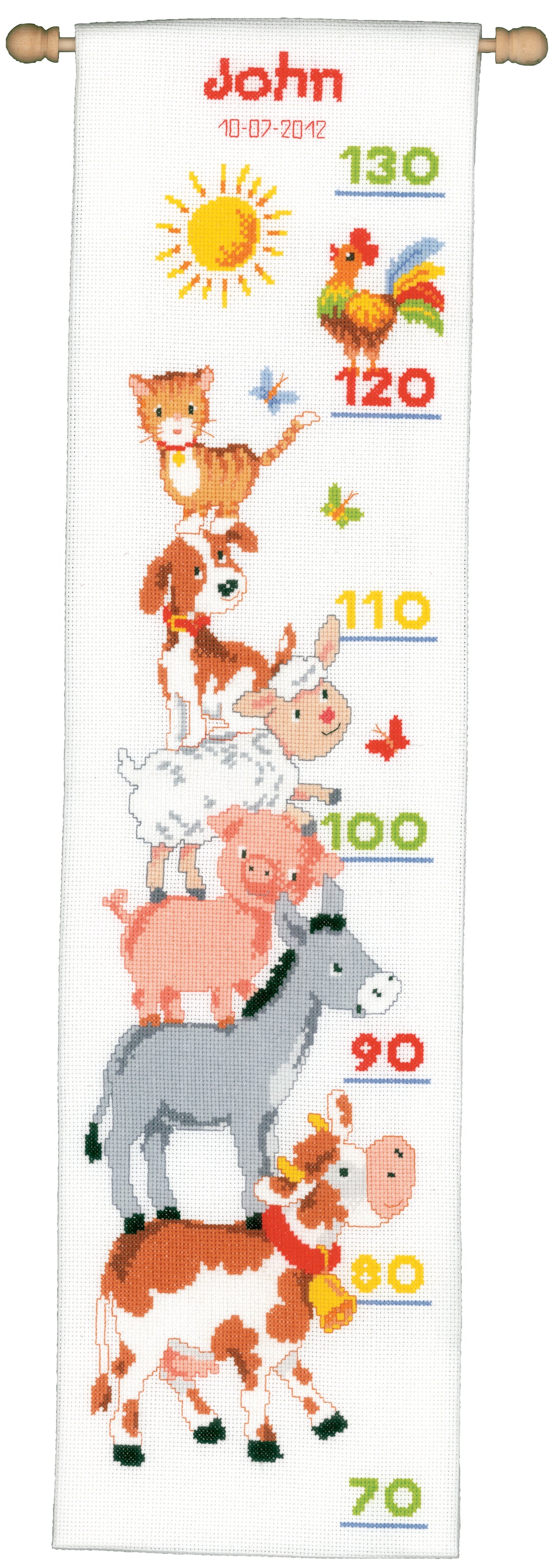 Cross stitched height chart decorated with farm animals