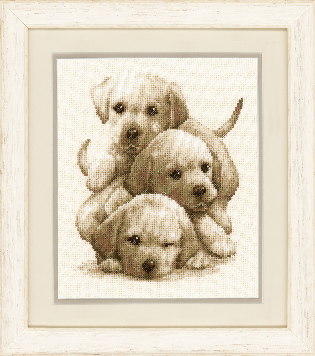 Counted cross stitch kit showing Labrador puppies
