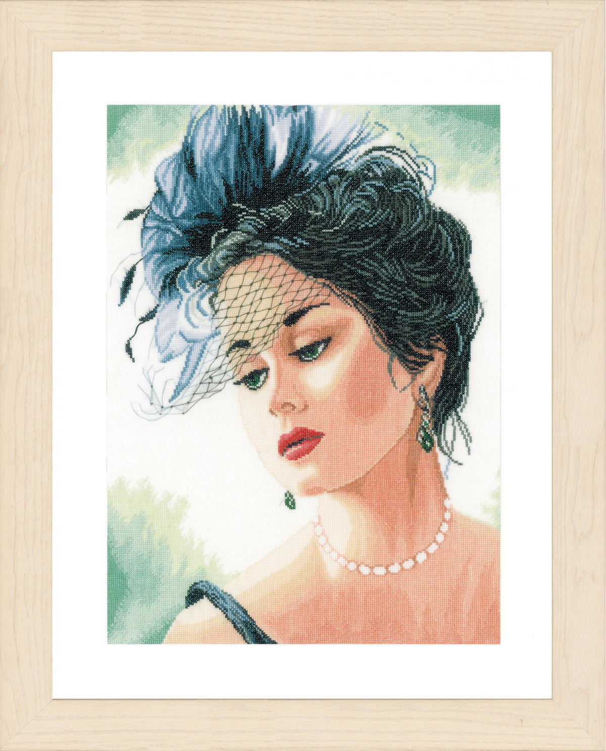 Cross stitch picture of a lady wearing a hat