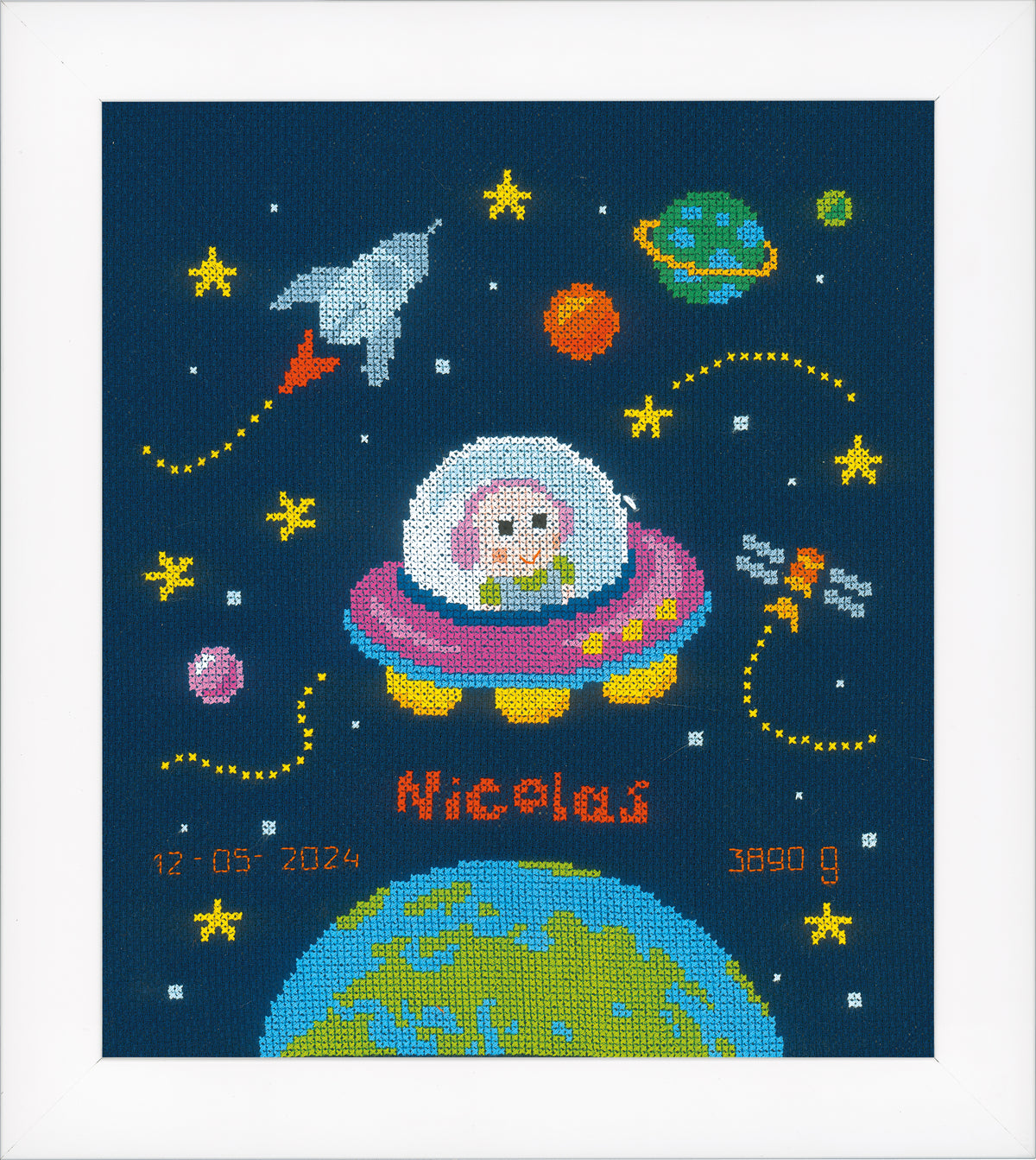 Baby astronaut cross stitch birth record on navy fabric