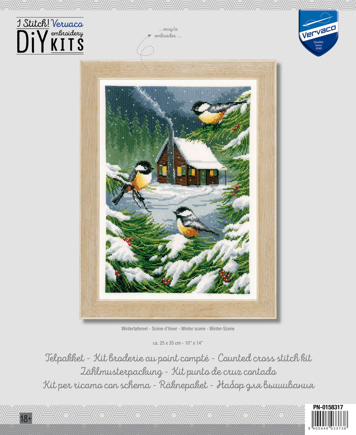 Cross stitch picture of a snowy winter scene