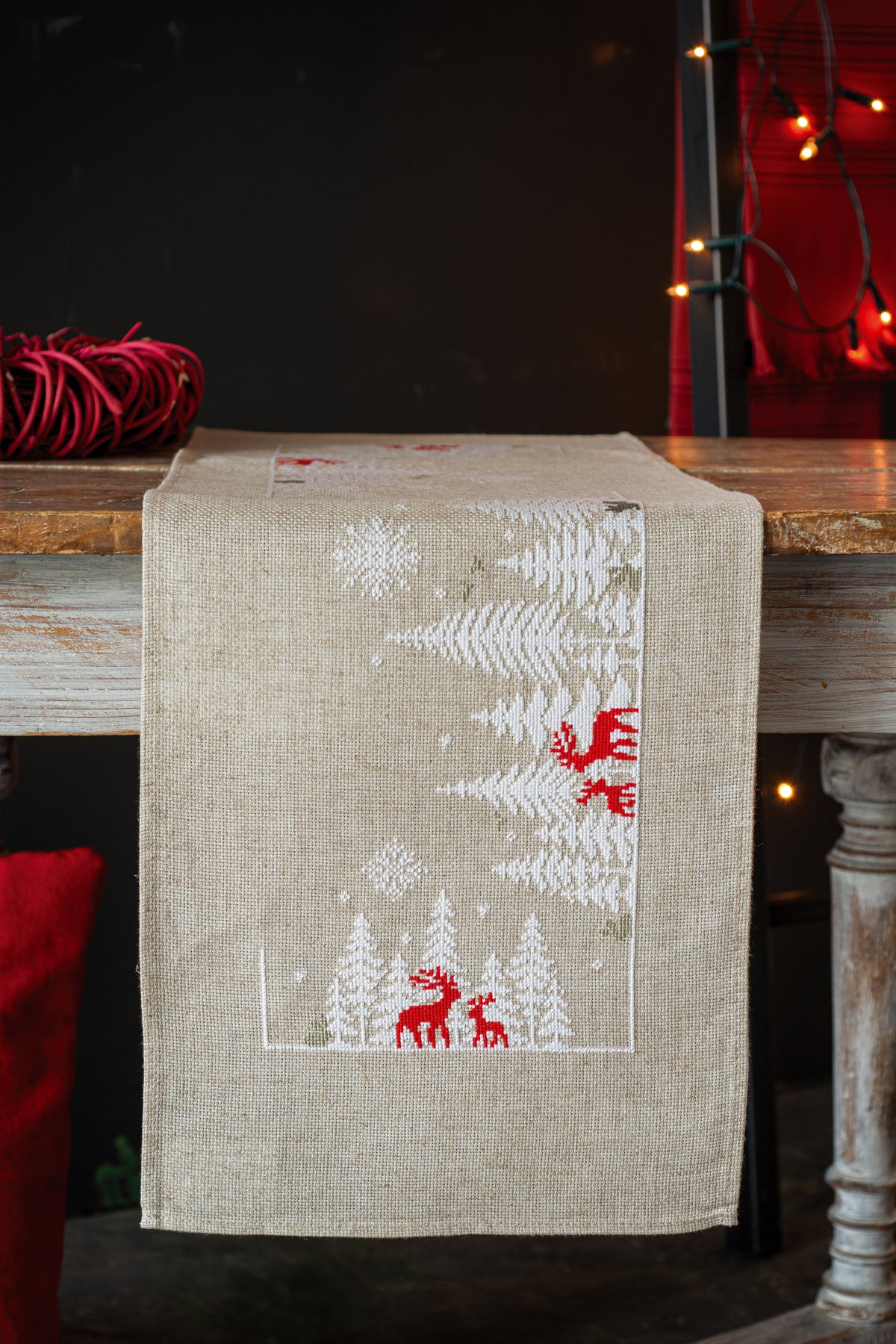 Linen-coloured table runner with a winter forest scene
