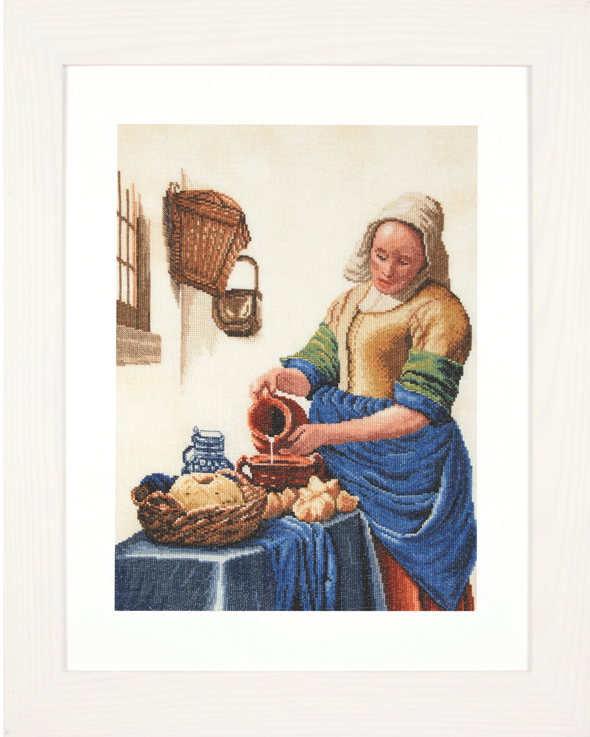Cross stitched picture of a milkmaid pouring milk