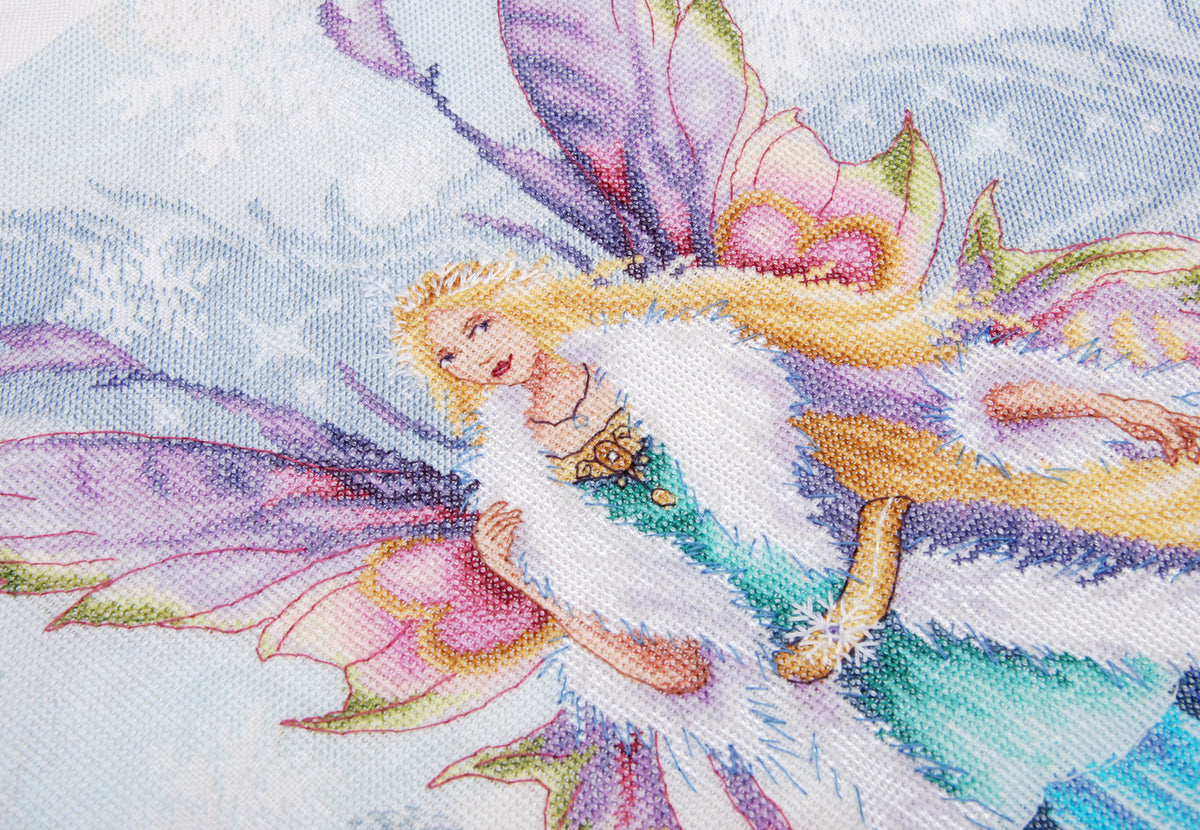 Cross stitch picture of a winter elf fairy