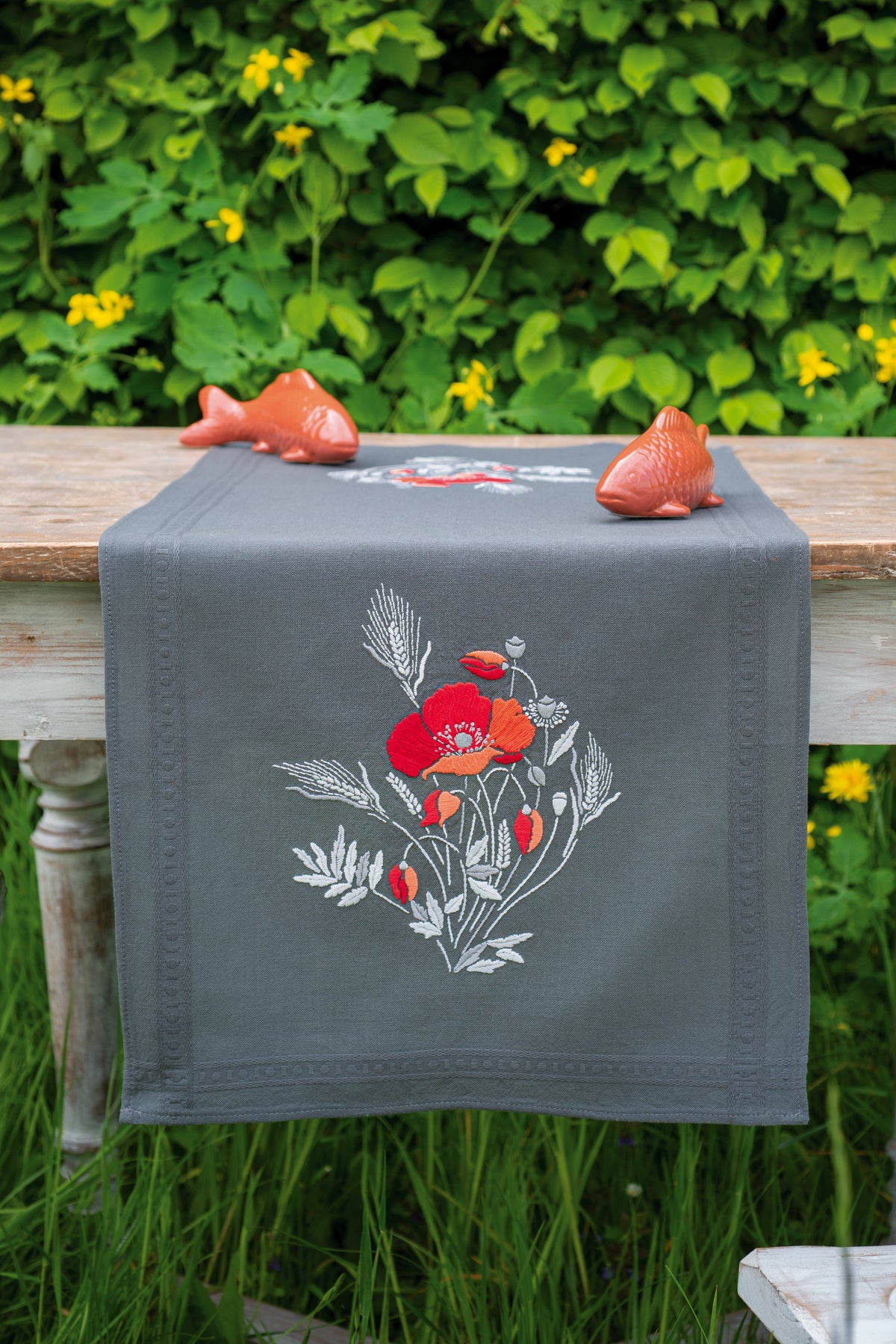 Embroidered table runner with red poppies