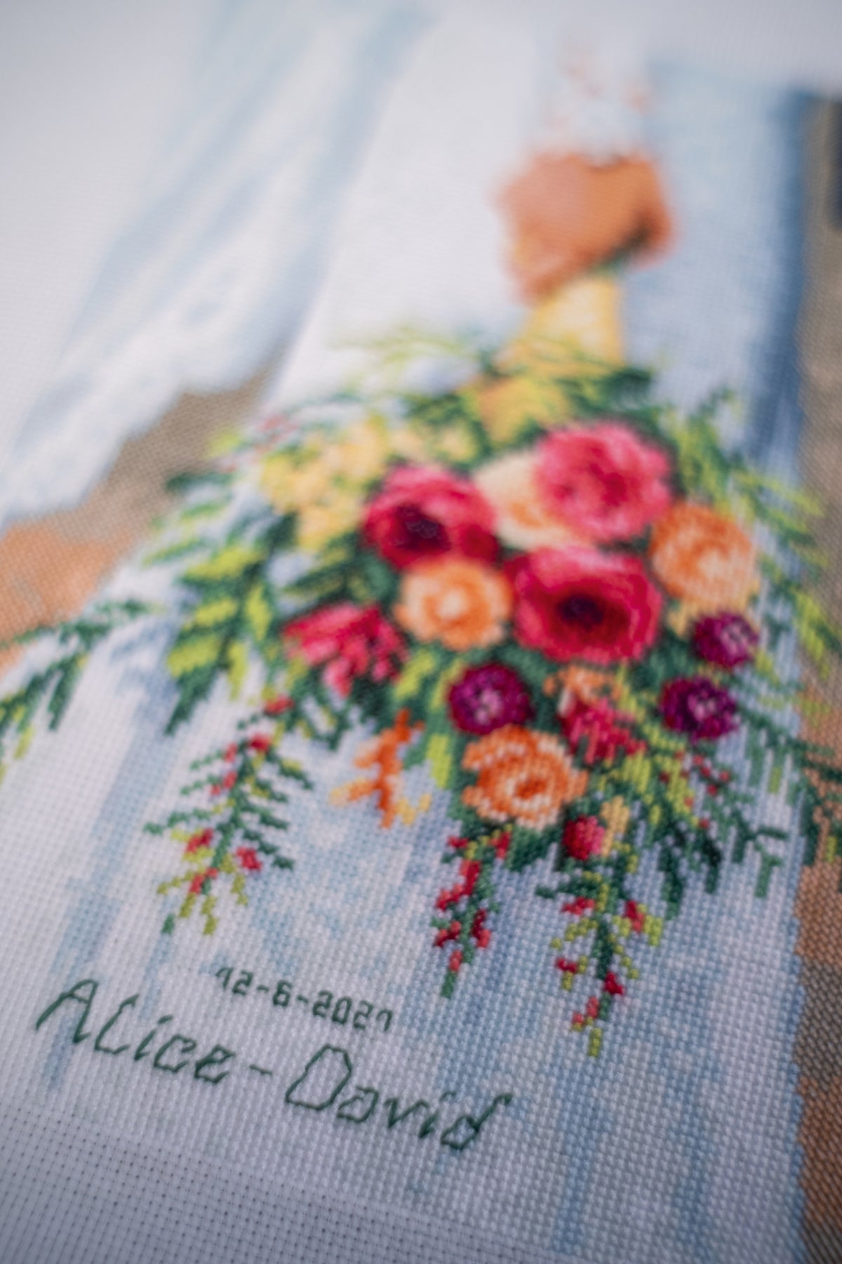 Cross stitched wedding record with a bridal bouquet design