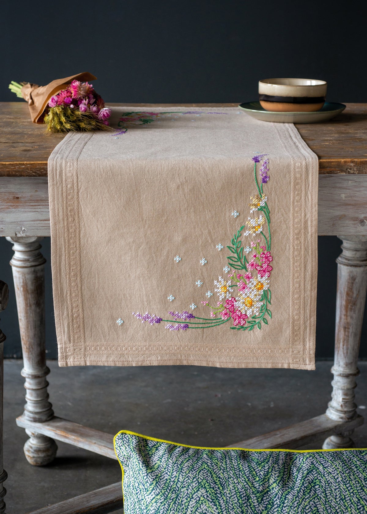 Embroidered table runner with a spring flowers design