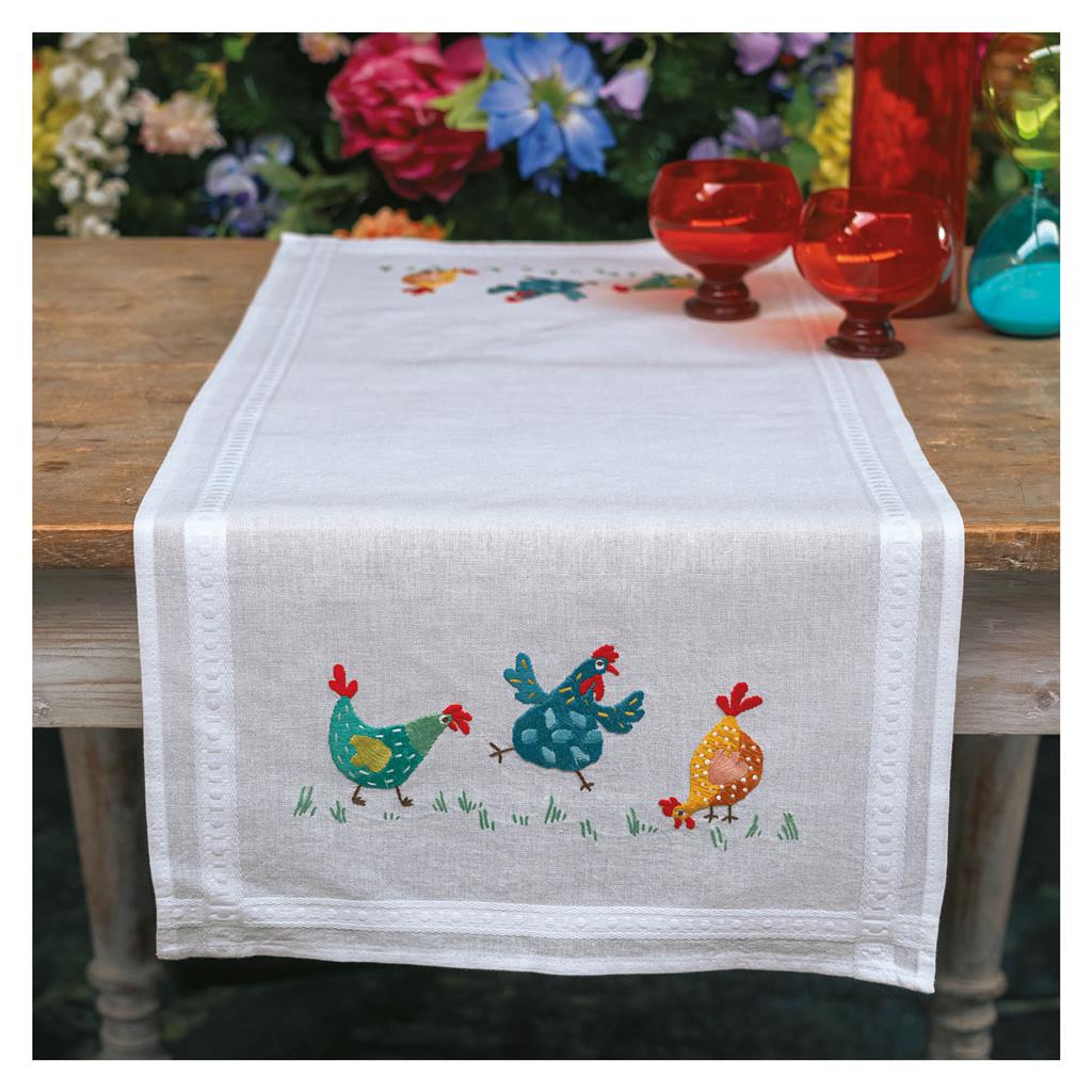 Embroidered table runner with colourful chickens