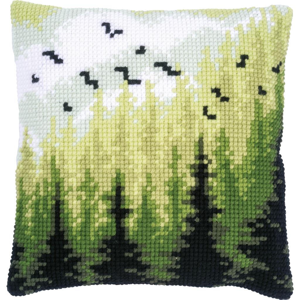 Square cushion stitched with a forest scene