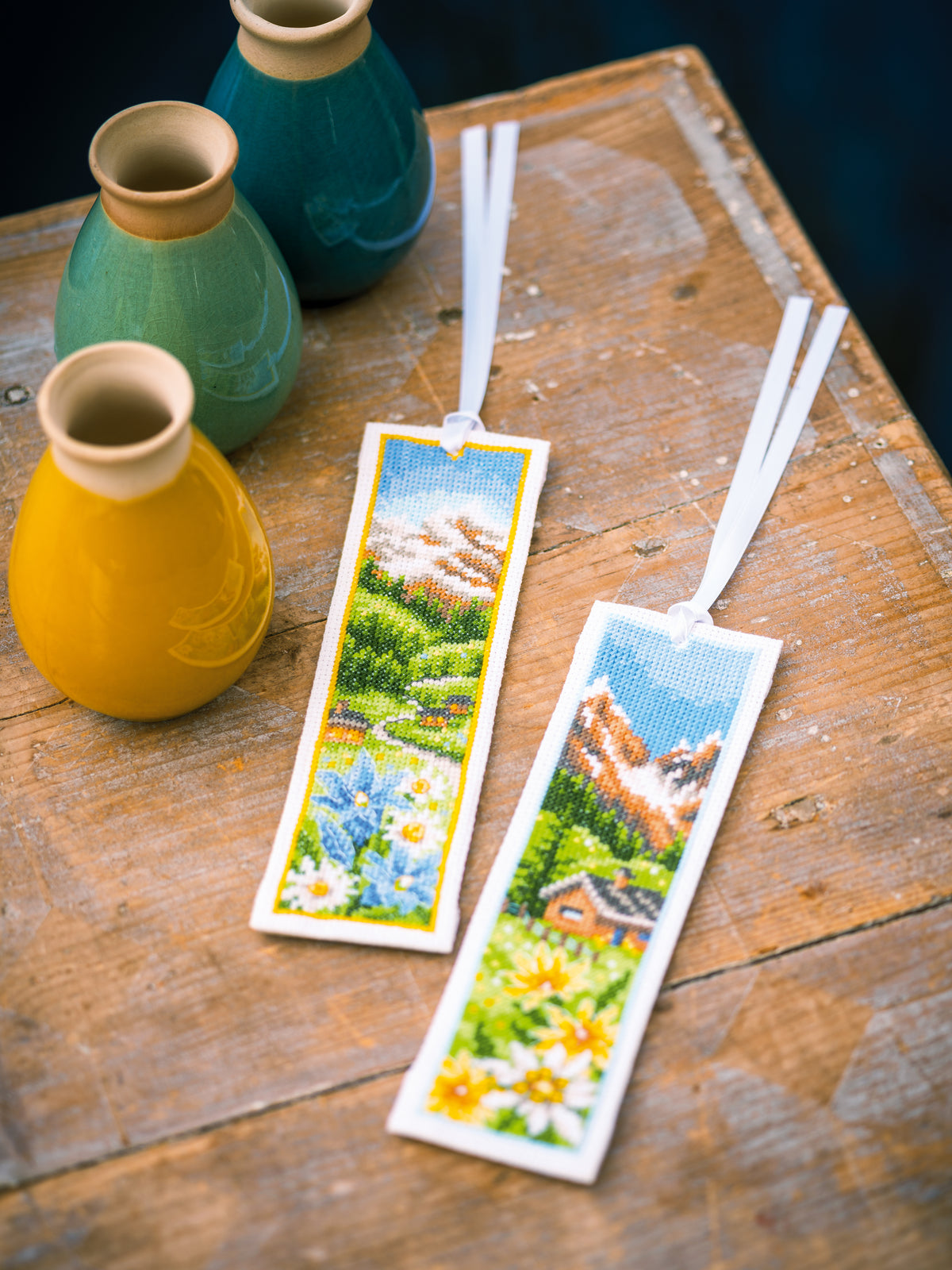 Two cross stitch bookmarks with alpine flowers