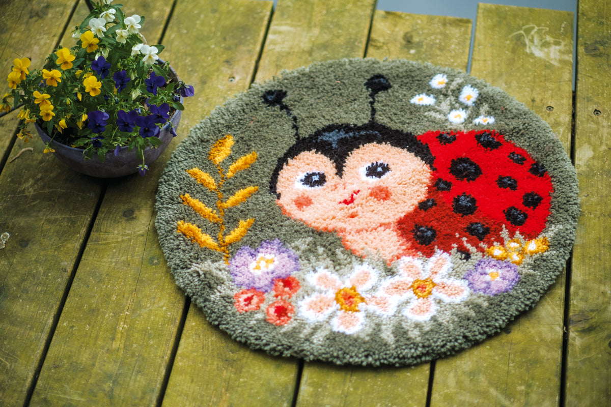 Ladybug shaped latch hook rug