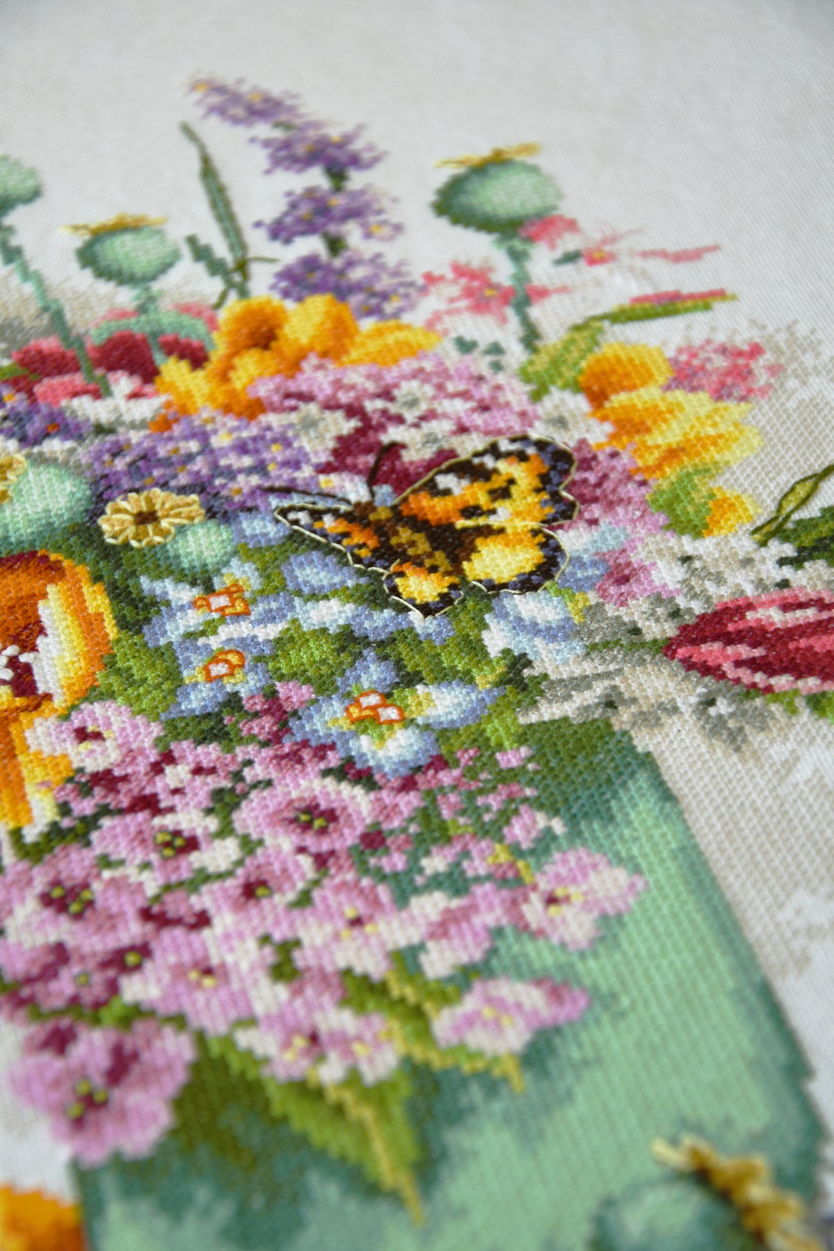 Cross stitch picture of a colourful flower bouquet
