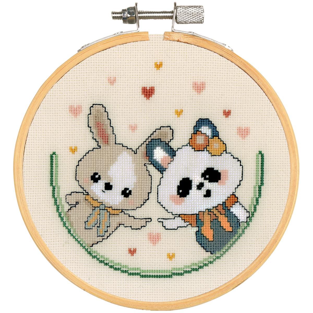 Cross stitch of a panda and bunny with a heart, shown in a hoop