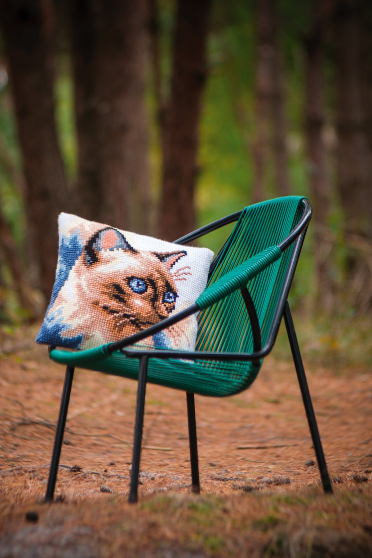 Square cross stitch cushion with siamese cat design