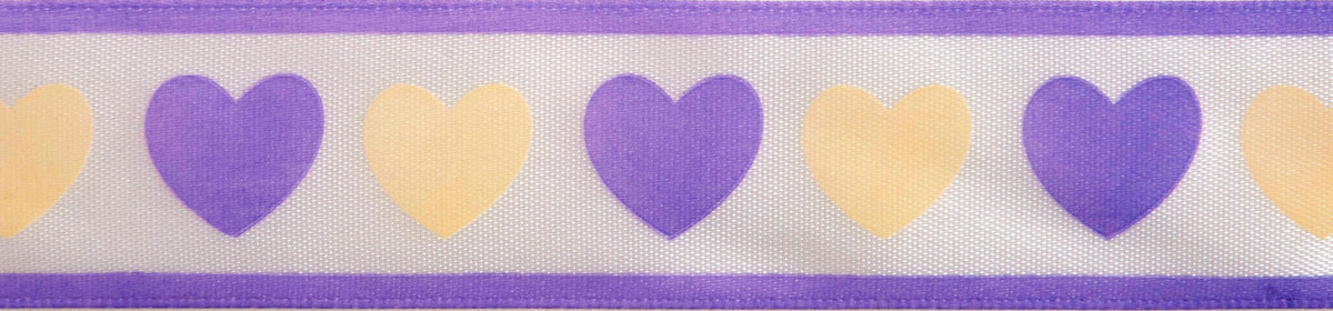 Reel of white ribbon printed with blue and yellow hearts