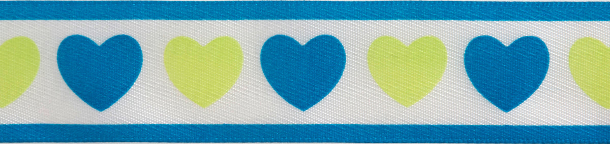 Reel of white ribbon printed with blue and green hearts