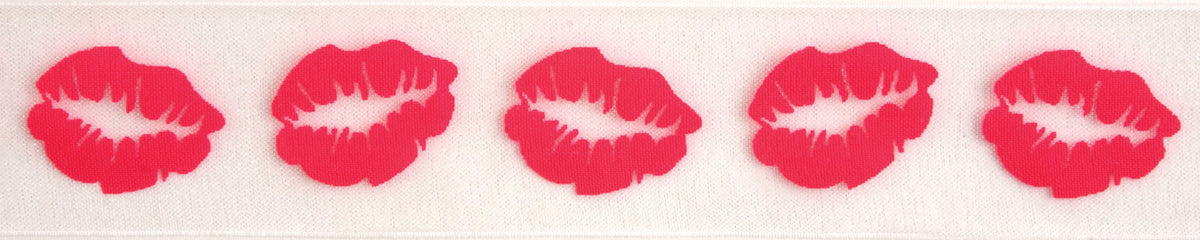 Reel of sheer white organdie ribbon printed with hot pink lips