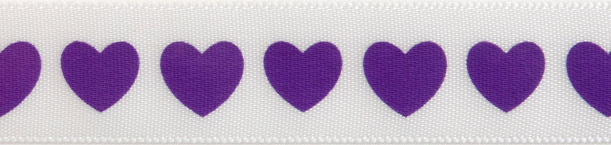 Reel of narrow white satin ribbon printed with purple hearts