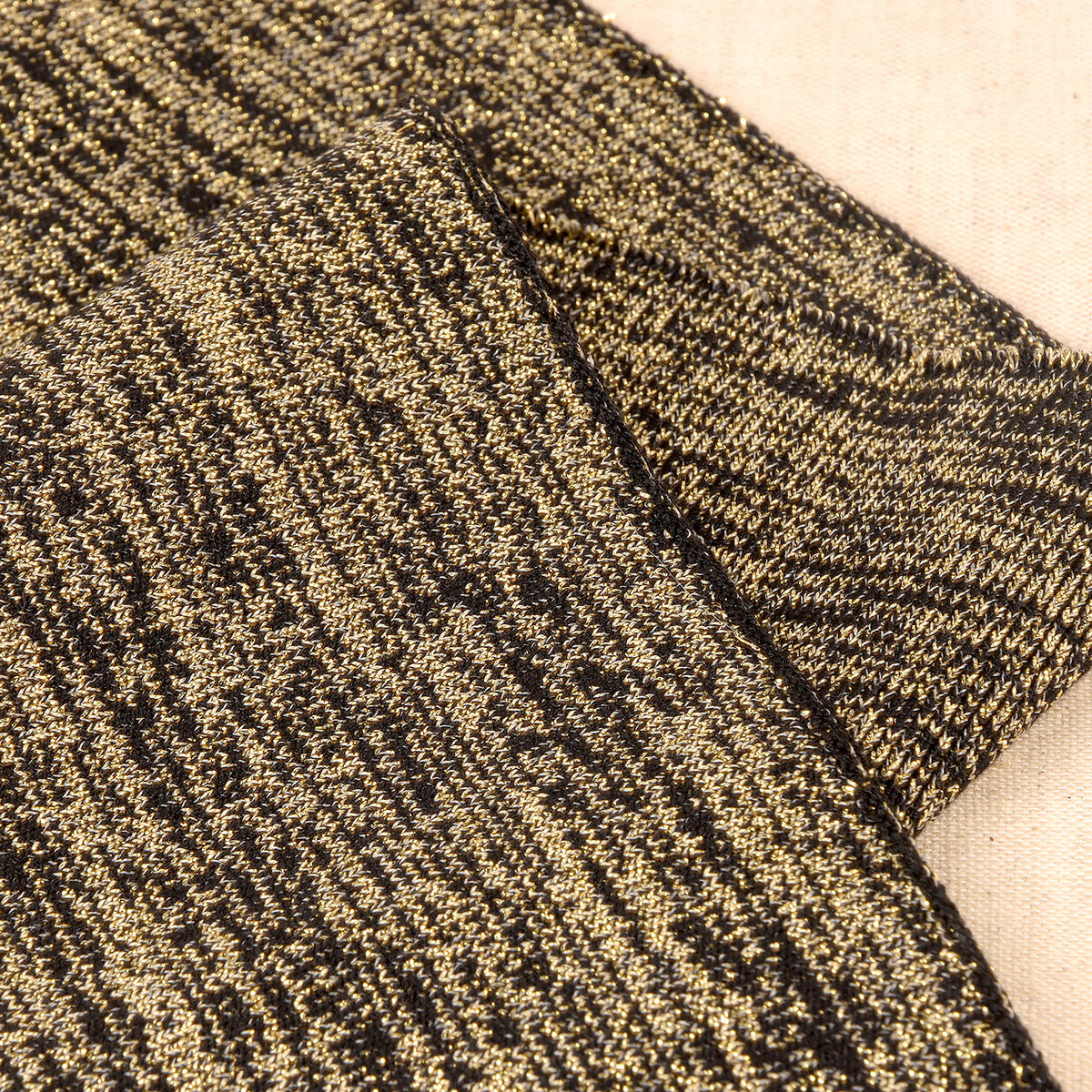Black and gold metallic knit cuff and waistband trim